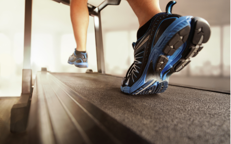 Closeup of a person running on a treadmill