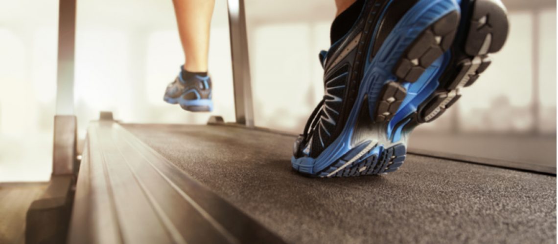 Closeup of a person running on a treadmill